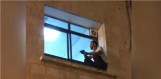 Un tânăr s-a urcat pe zidul spitalului ca să își vadă mama de la fereastră. Femeia a murit de COVID fiul spital palestina covid