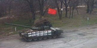 Soldații ruși care au comis crime sunt căutați prin metode avansate: sateliți, programe de recunoaștere facială sau analize ADN tanc steag urss